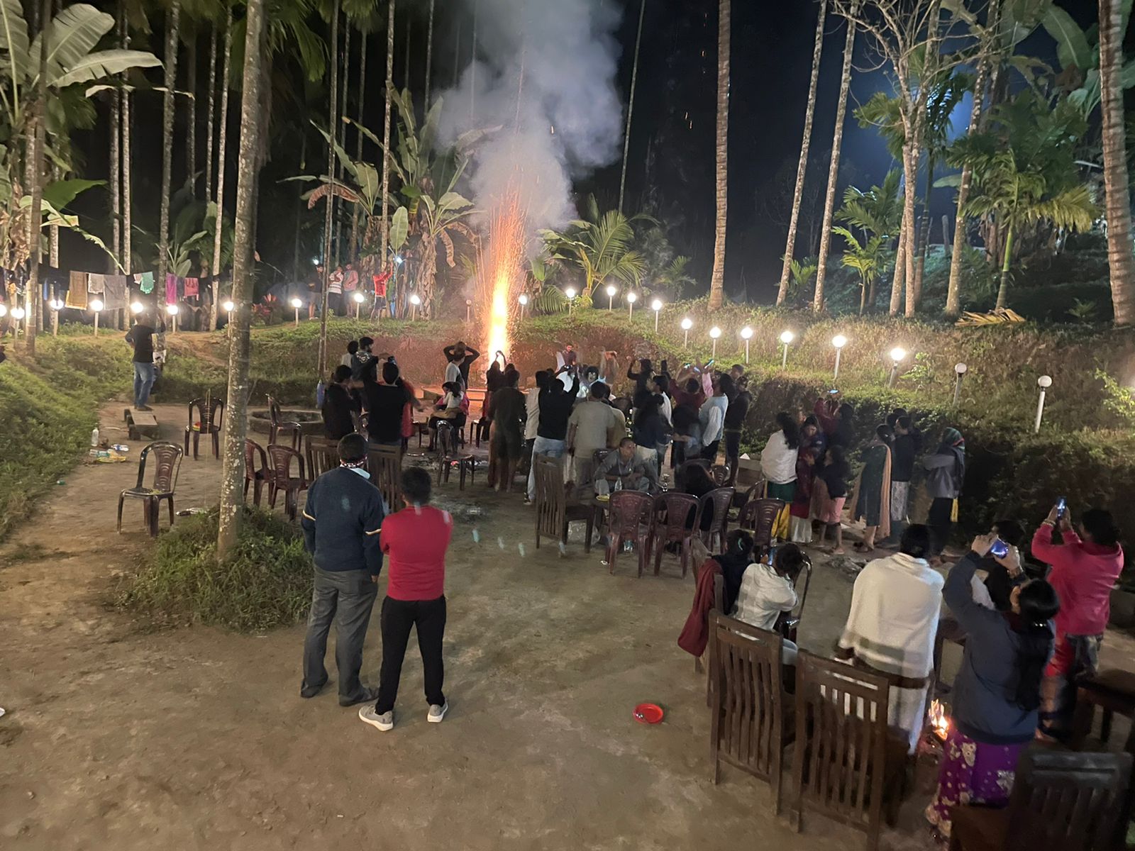 A couple enjoying a romantic dinner at a Dandeli resort.