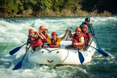 A family enjoying a water rafting trip in Dandeli.